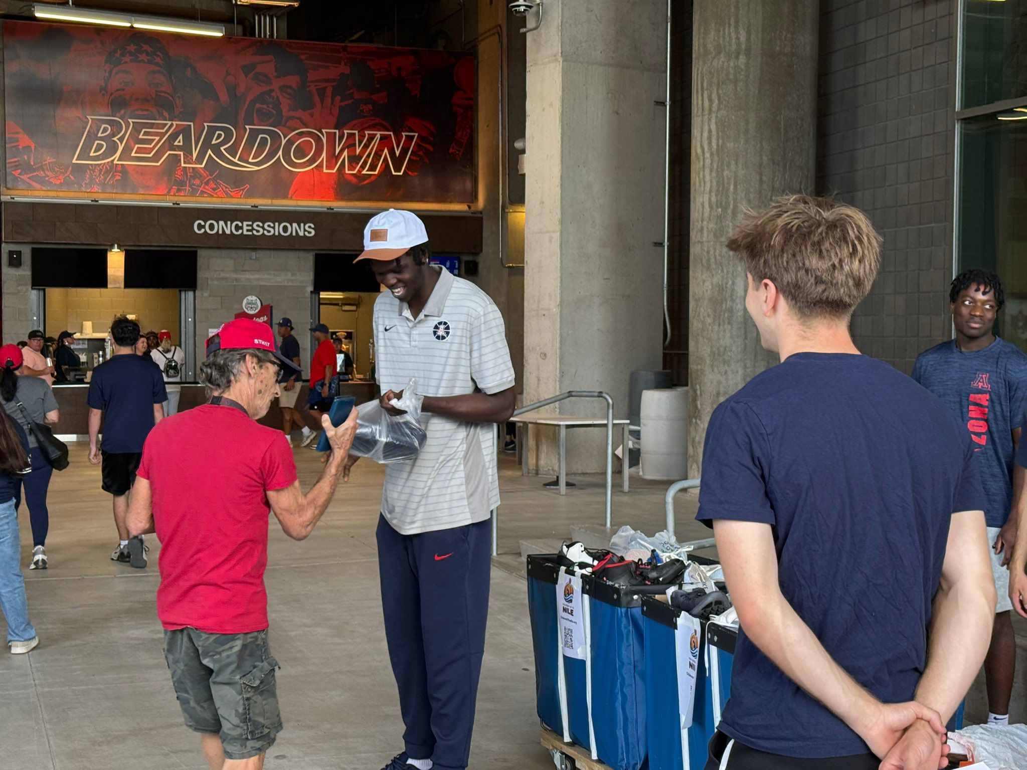 Mabilmawut engages with supporters during the shoe drive