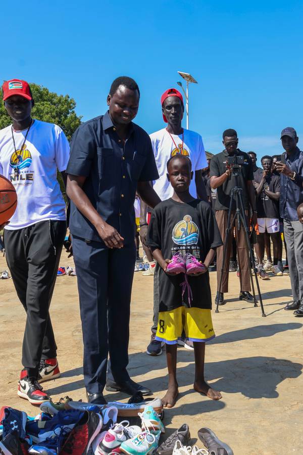 One of the campers receives his first shoe during our camp in Bor